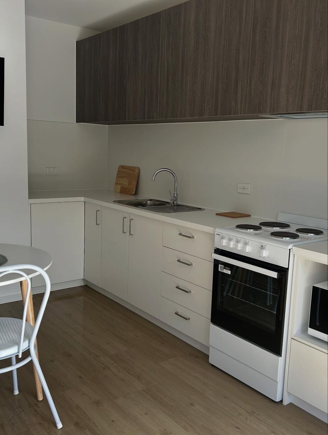 Kitchenette detail with kettle, toaster and board